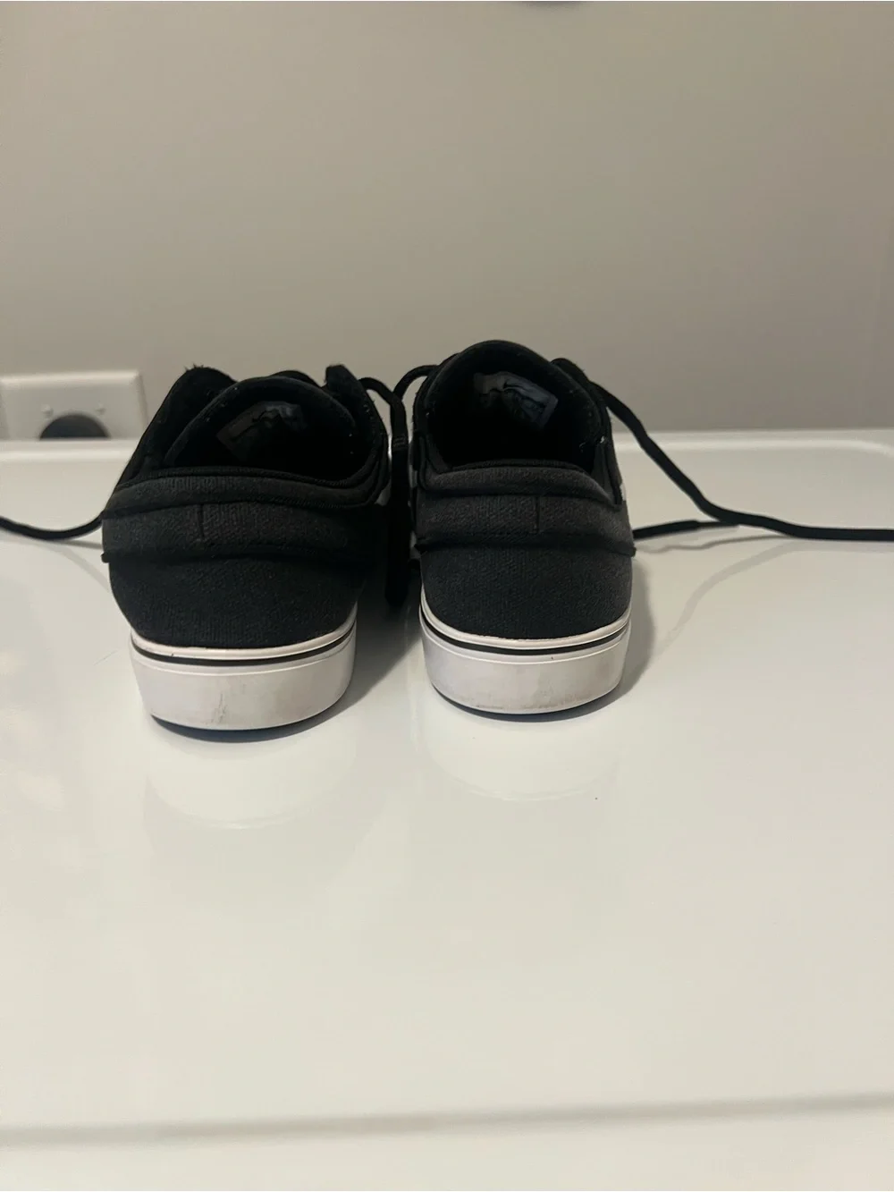 Nike Black Low-Top Sneakers with White Swoosh